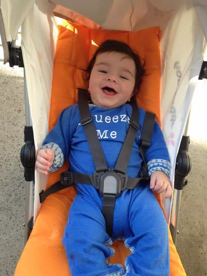 happy baby in UPPAbaby G-Luxe Stroller seat