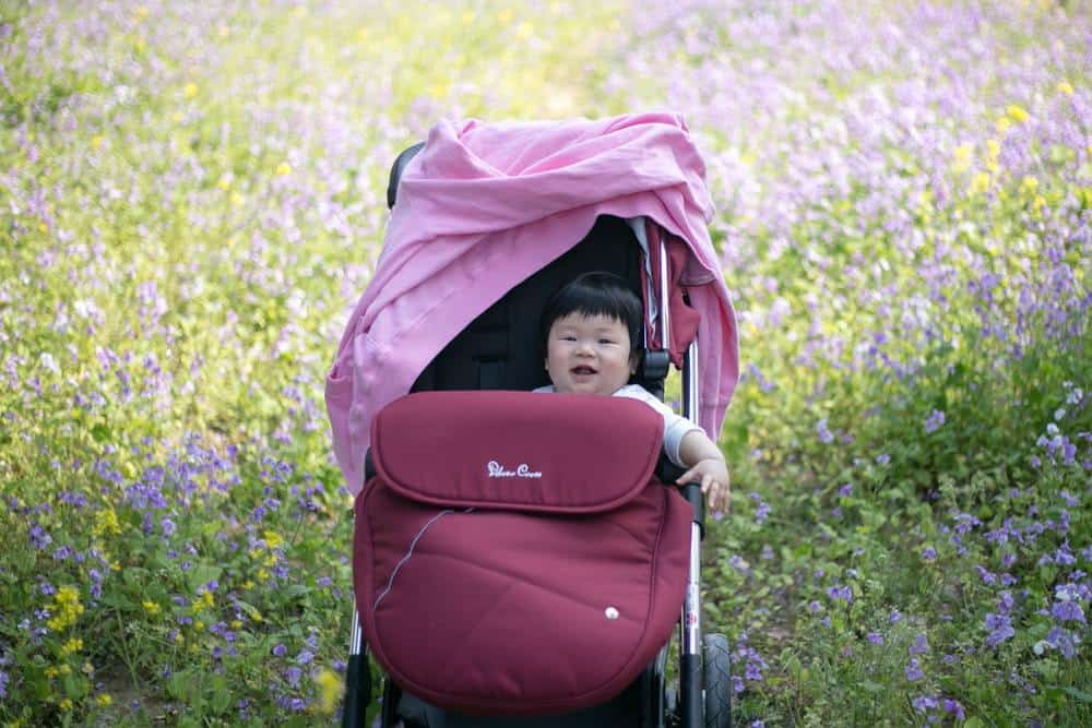 baby laughing in stroller