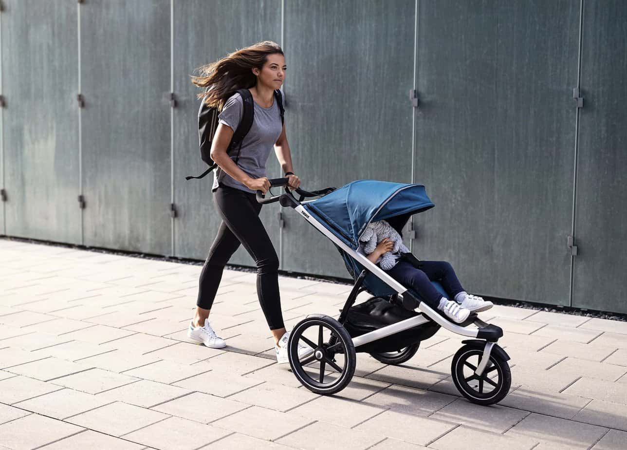 woman walking with the Thule Urban Glide 2 stroller