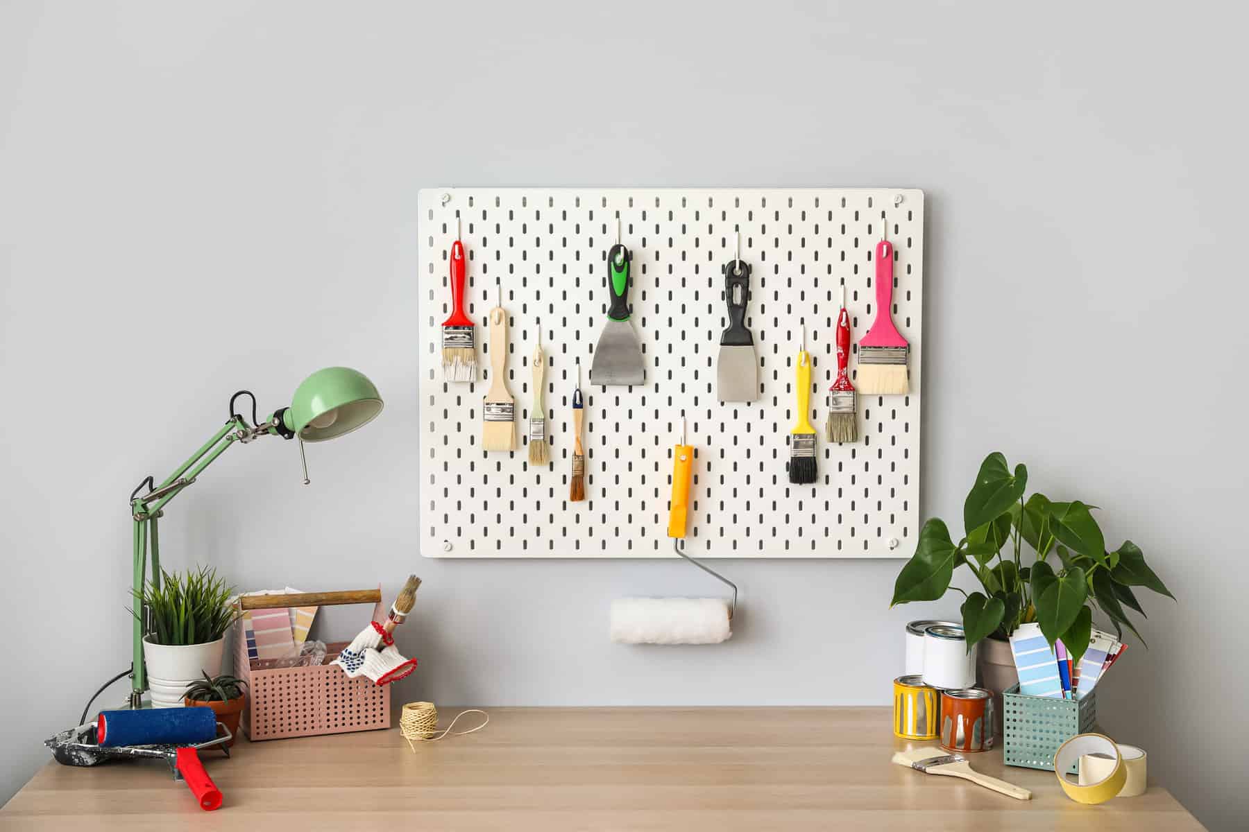 Pegboard with Paint Brushes
