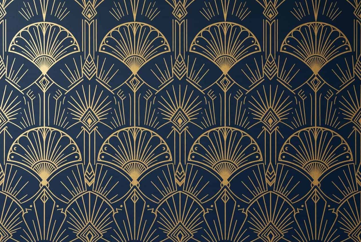 Close-up of a deep navy blue and warm gold geometric wallpaper pattern featuring symmetrical fan and diamond shapes.