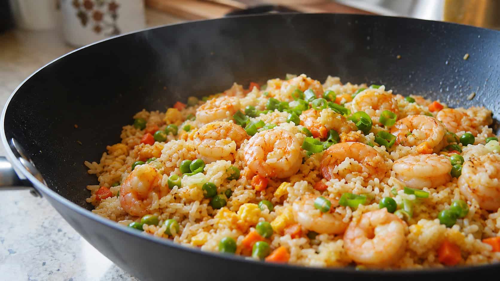 shrimp fried rice with peas, carrots and green onions in a wide wok, glistening and steaming, on a kitchen counter, natural light, shallow depth of field, wide horizontal landscape composition