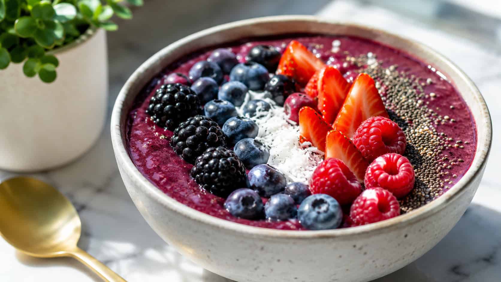 a vibrant berry smoothie bowl in a wide horizontal shot, deep purple base, fresh berries and chia seeds arranged on top, bright morning light, shallow depth of field, landscape orientation