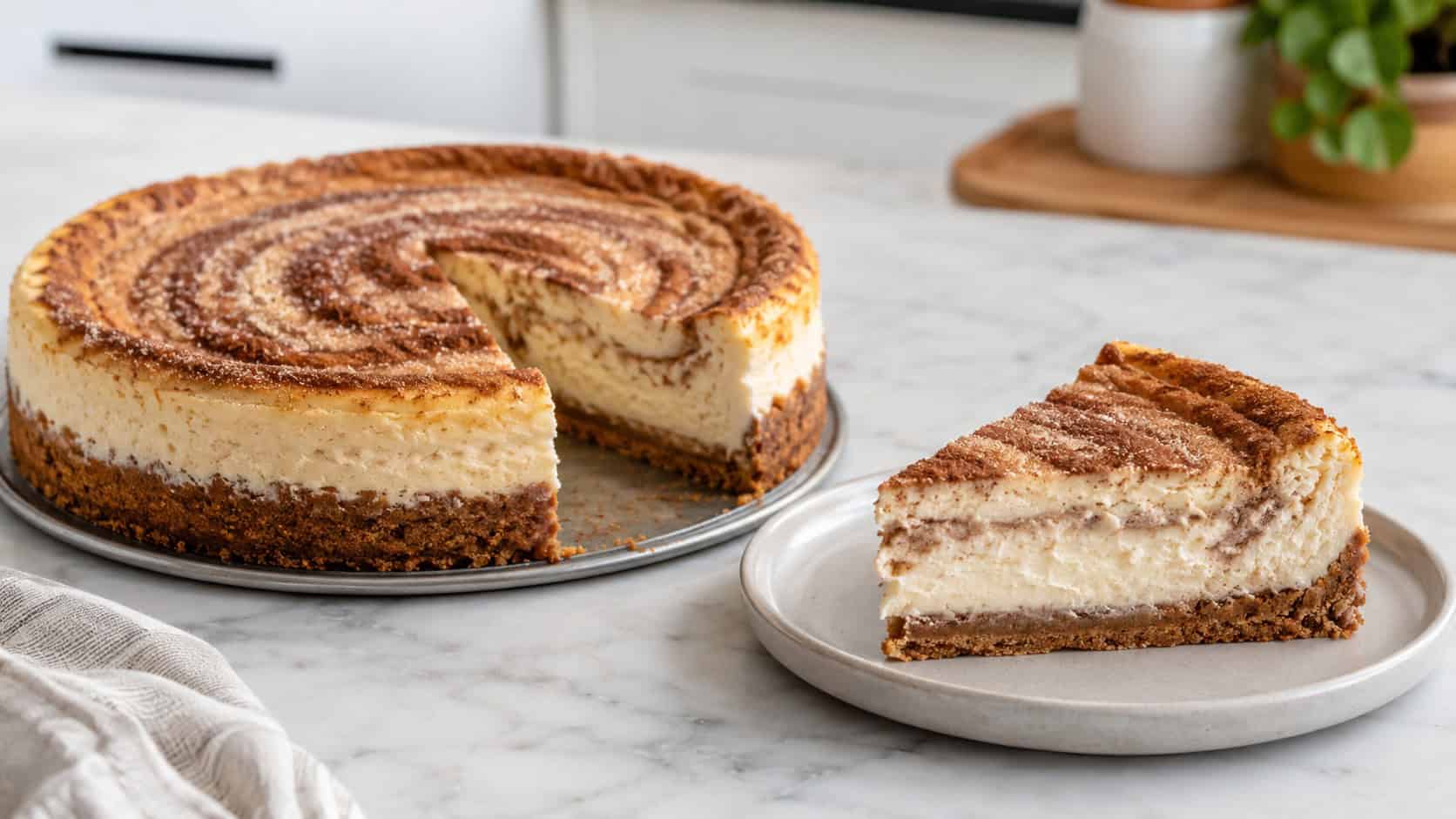 a creamy cinnamon cheesecake with a cookie-crumb crust and cinnamon-sugar swirl in a wide horizontal shot, one slice plated beside the whole cake on a marble counter, soft natural light, shallow depth of field, landscape orientation