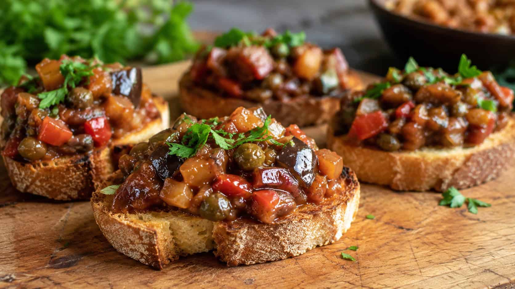 chunky eggplant caponata spooned over toasted crostini on a rustic board, wide horizontal shot, glossy sweet-sour glaze, parsley garnish, natural light, shallow depth of field, landscape orientation