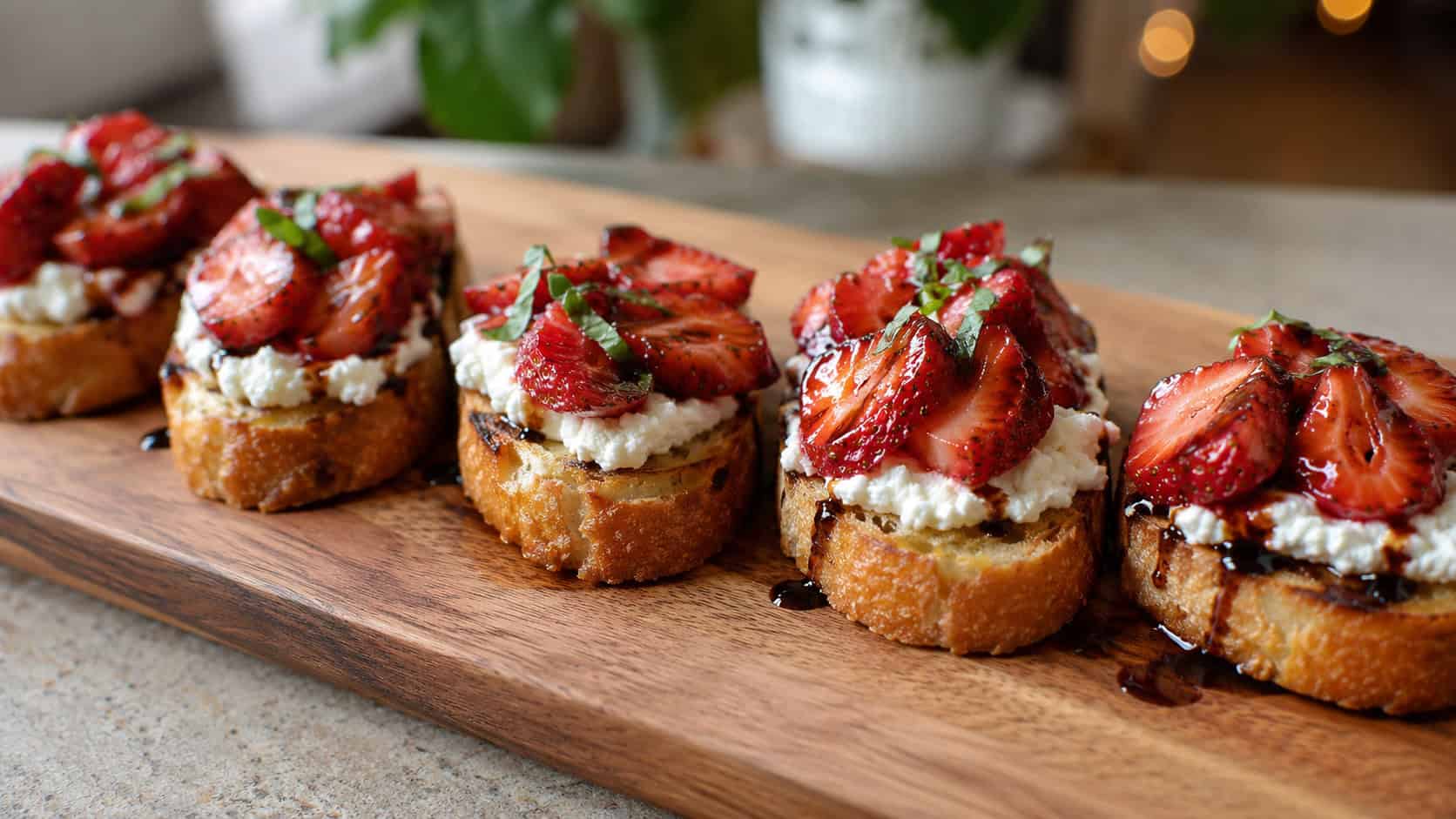 crostini topped with creamy ricotta and glossy balsamic-roasted strawberries, arranged in a wide horizontal row on a wooden board, glistening juices, soft natural light, shallow depth of field, landscape orientation