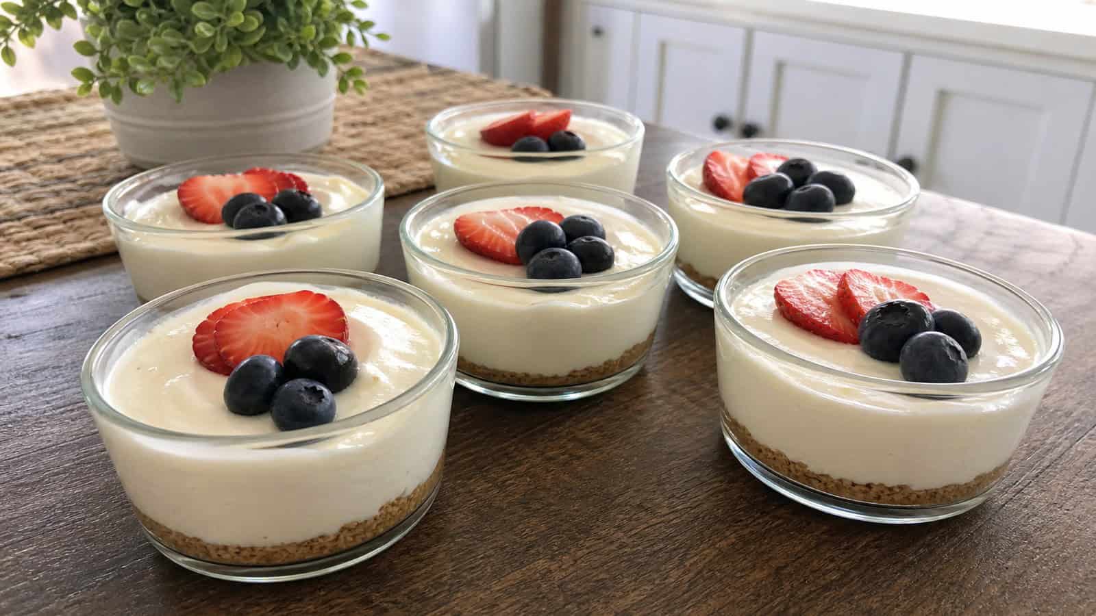 keto cheesecake pudding in small glass cups on a home kitchen table