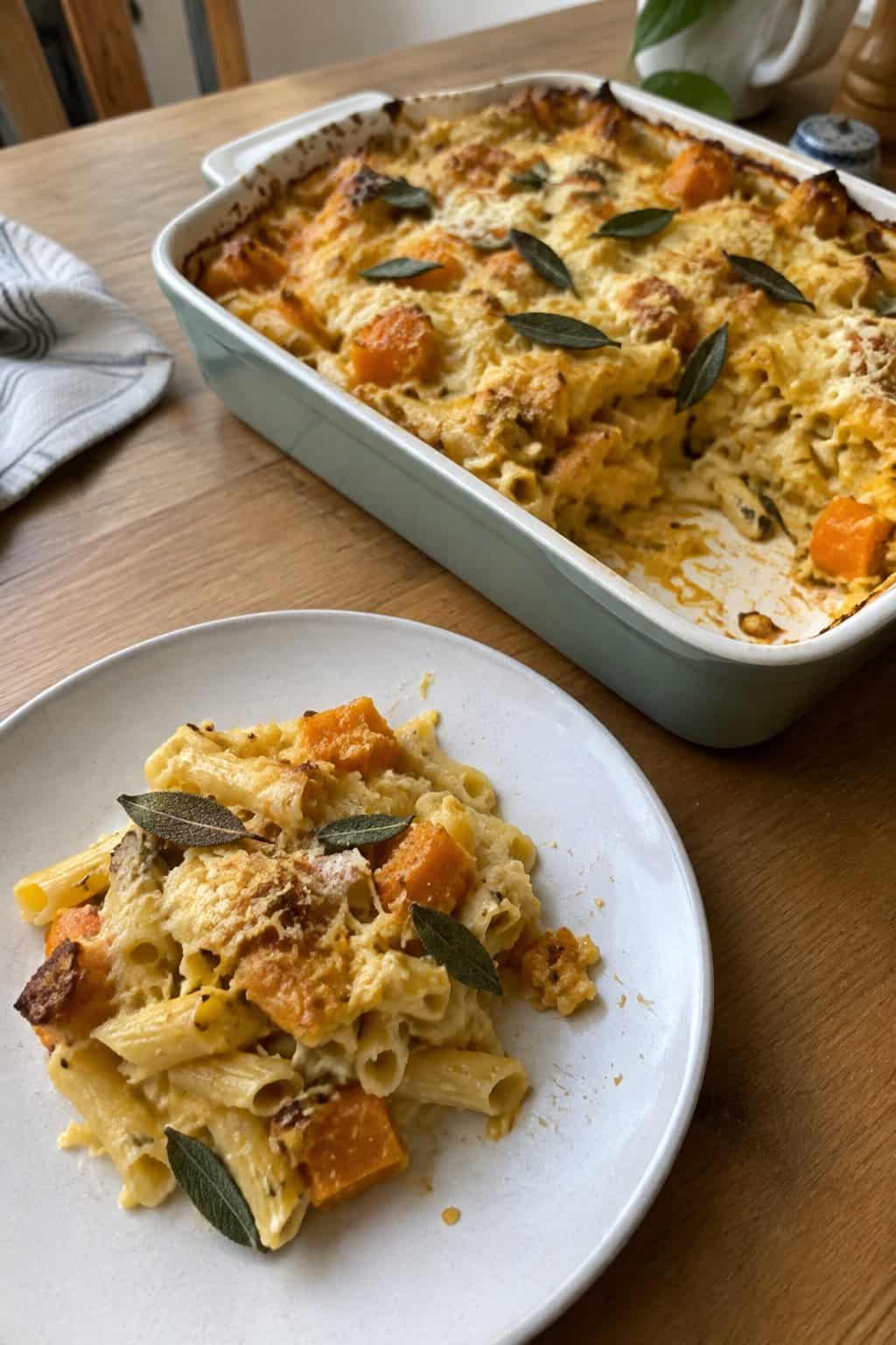 A serving of butternut squash and sage pasta bake on a plate.