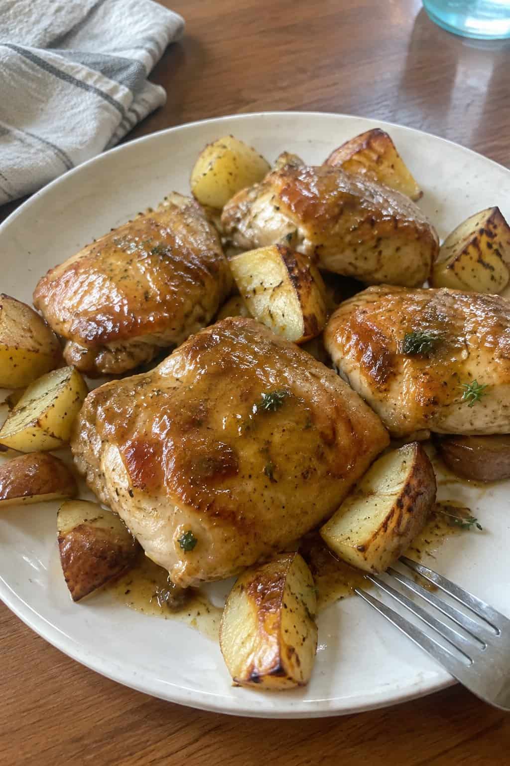 Roasted chicken and potatoes coated in honey-mustard sauce.