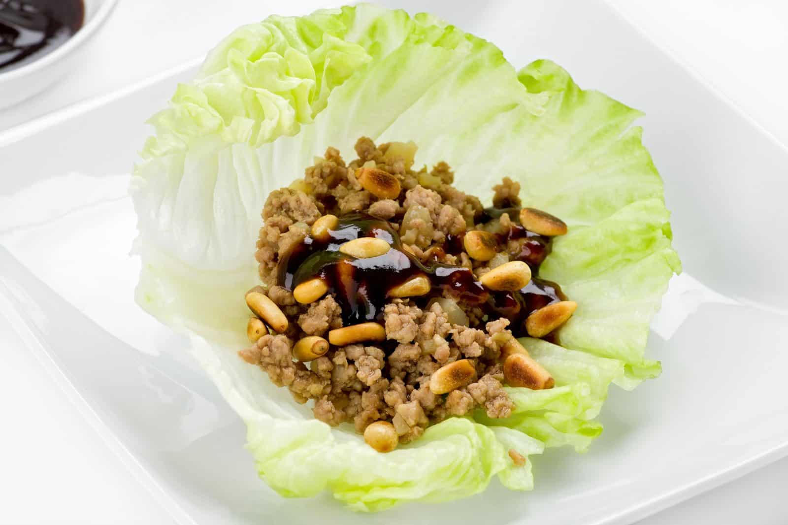 These 20 Easy Ground Beef and Rice Dishes Will Save Your Busy Weeknights 64 Asian Beef and Rice Lettuce Wraps on a plate
