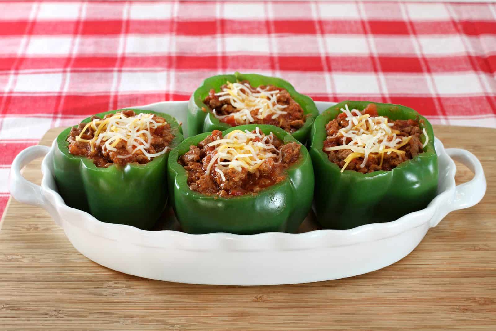 20 Easy Ground Beef Recipes for Weeknight Dinners 8 Cheesy Taco-Stuffed Bell Peppers on a plate