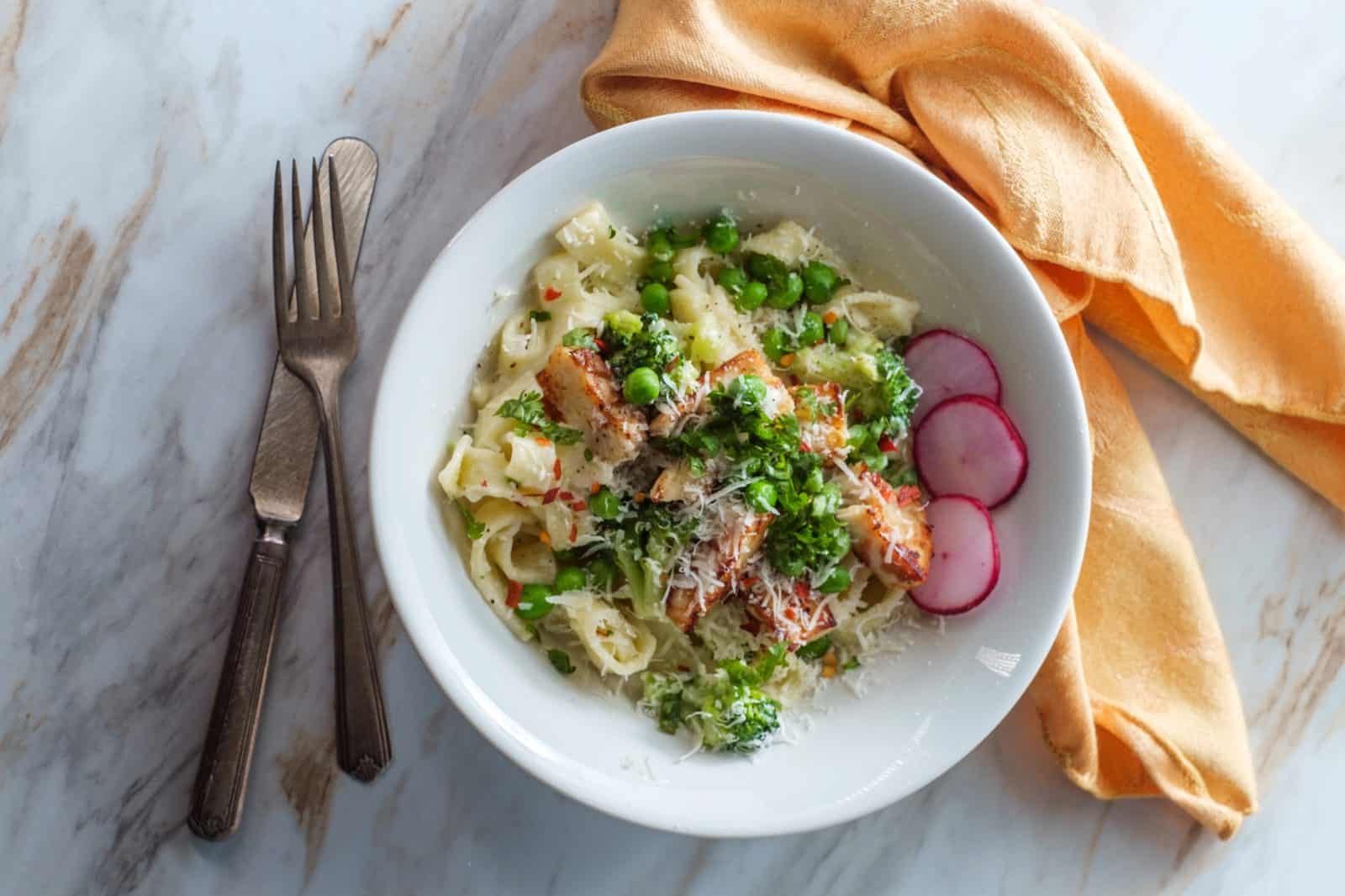 Kid-Friendly Chicken Dinners Adults Still Want to Eat 19 One-Pan Chicken Alfredo with Peas on a plate