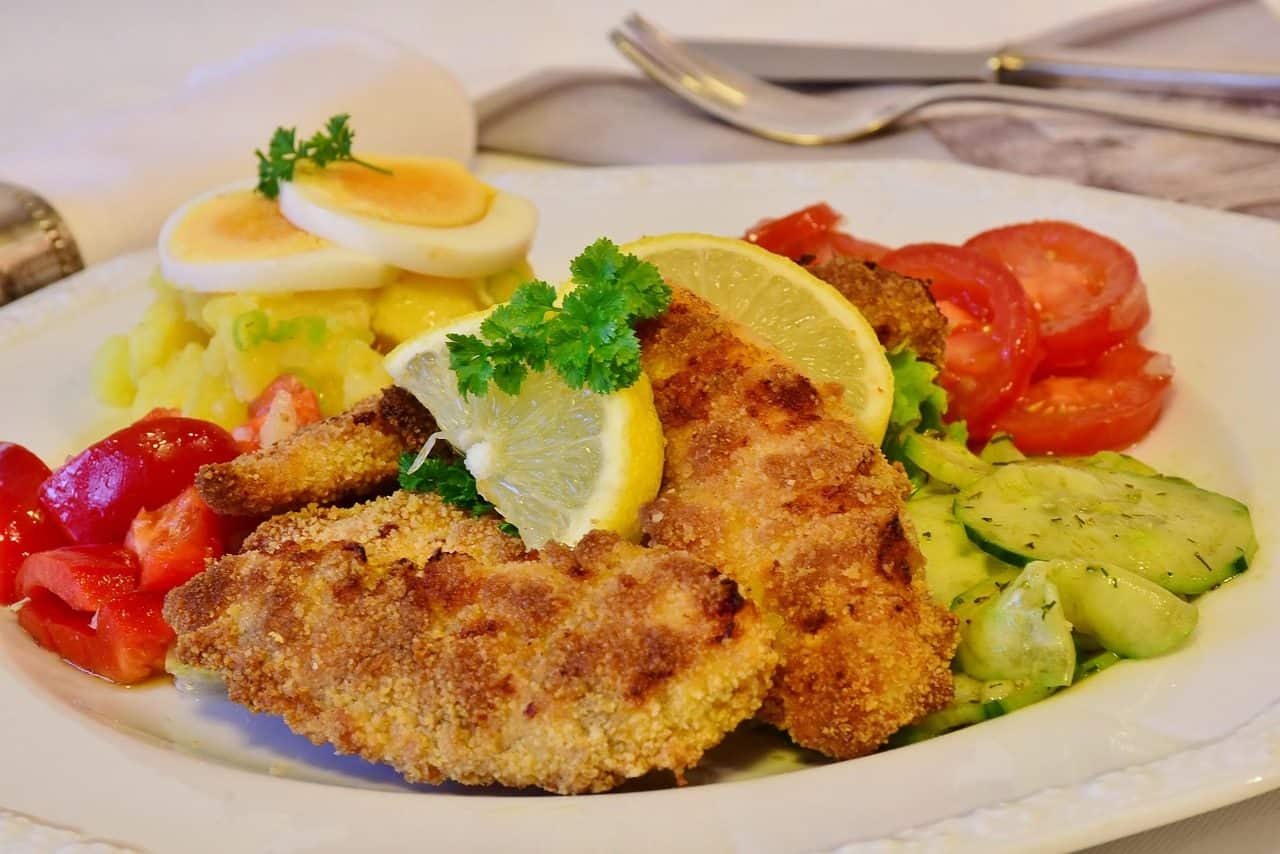 Kid-Friendly Chicken Dinners Adults Still Want to Eat 27 Crispy Chicken Schnitzel with Buttered Noodles on a plate