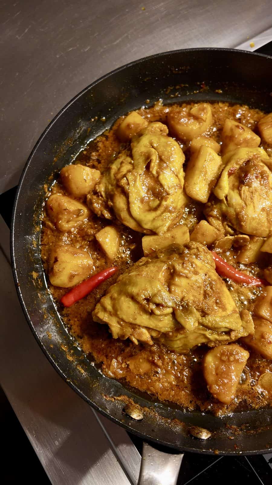 Chicken simmering with potatoes