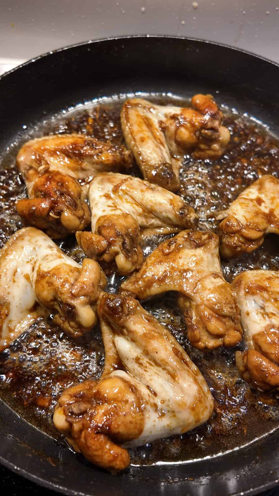 Coca-Cola Chicken Wings for a Sweeter Version of Orange Chicken 3 Coca-cola sauce is thickened and chicken wings are almost ready.