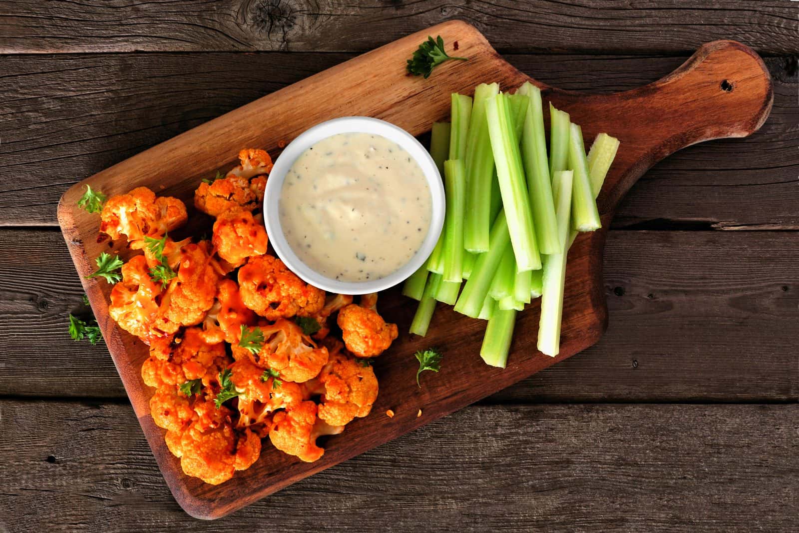 Vegan Appetizers That Disappear Fast at Parties 3 Crispy Buffalo Cauliflower Bites on a plate