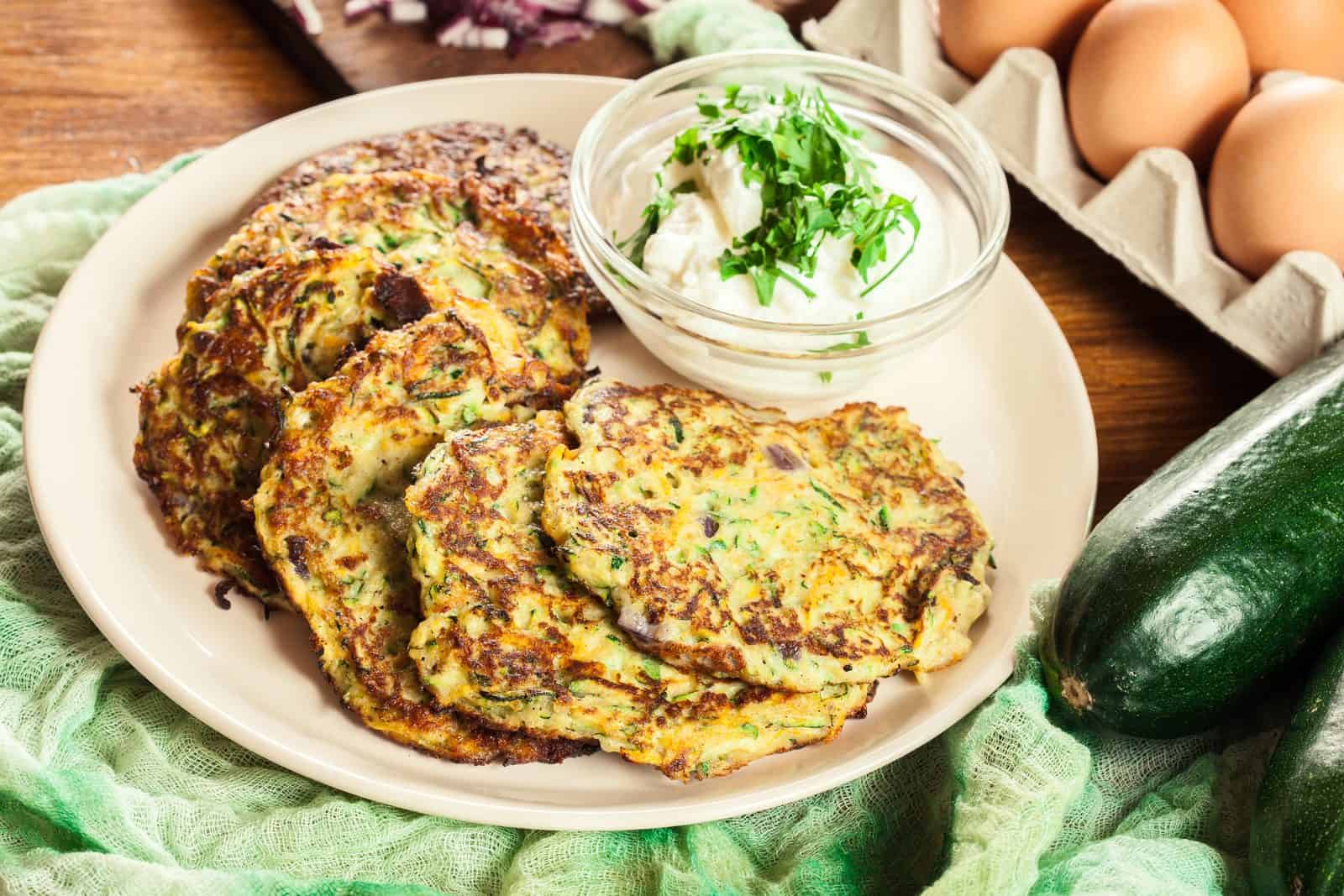 Vegan Appetizers That Disappear Fast at Parties 43 Crispy Zucchini Fritters on a plate