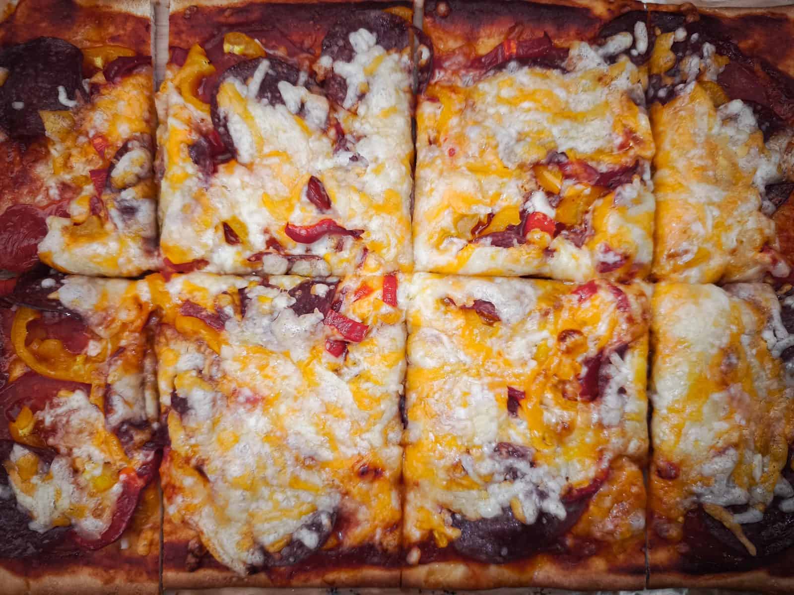 22 Easy Costco Party Appetizers 18 Kirkland frozen pizza squares cut into party bite