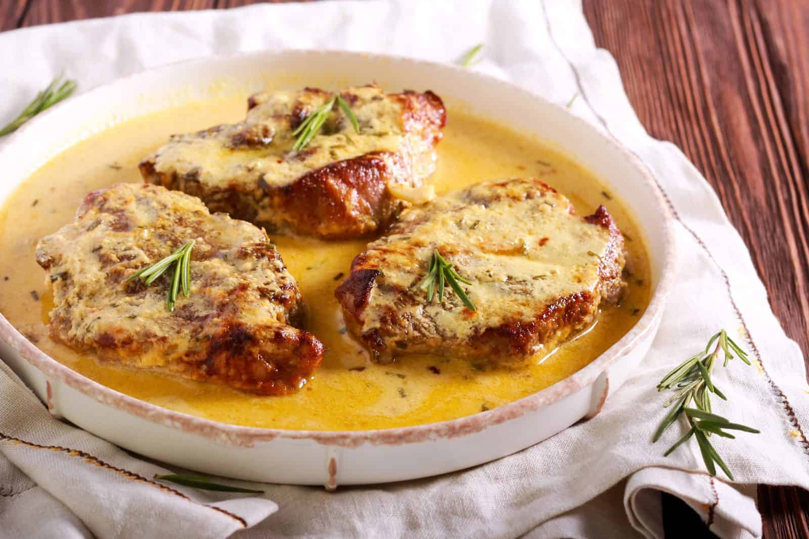 Crockpot Boneless Pork Chop Recipes for Hungry Families 4 Creamy Ranch Pork Chops on a plate