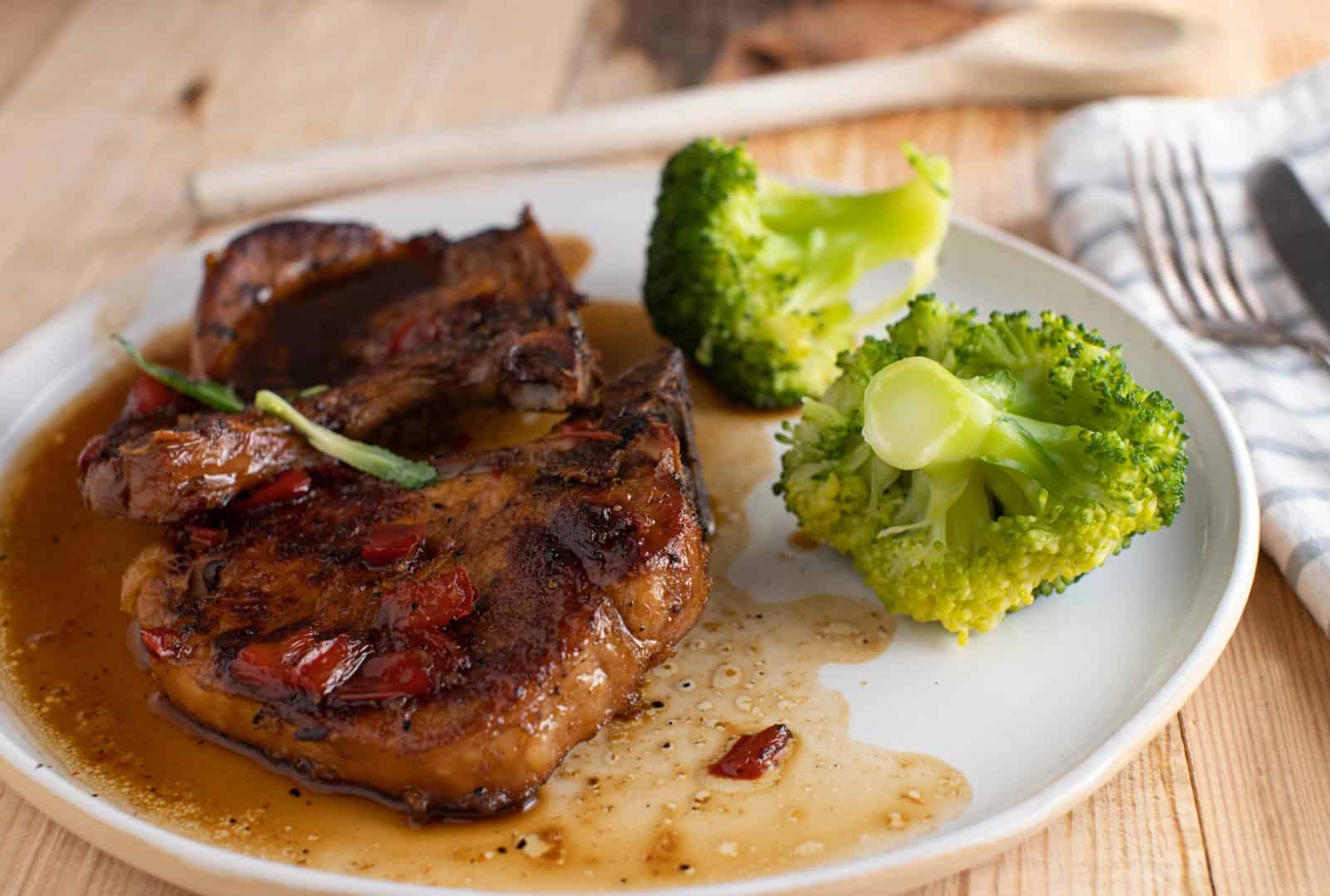 Crockpot Boneless Pork Chop Recipes for Hungry Families 8 Brown Sugar Garlic Pork Chops on a plate
