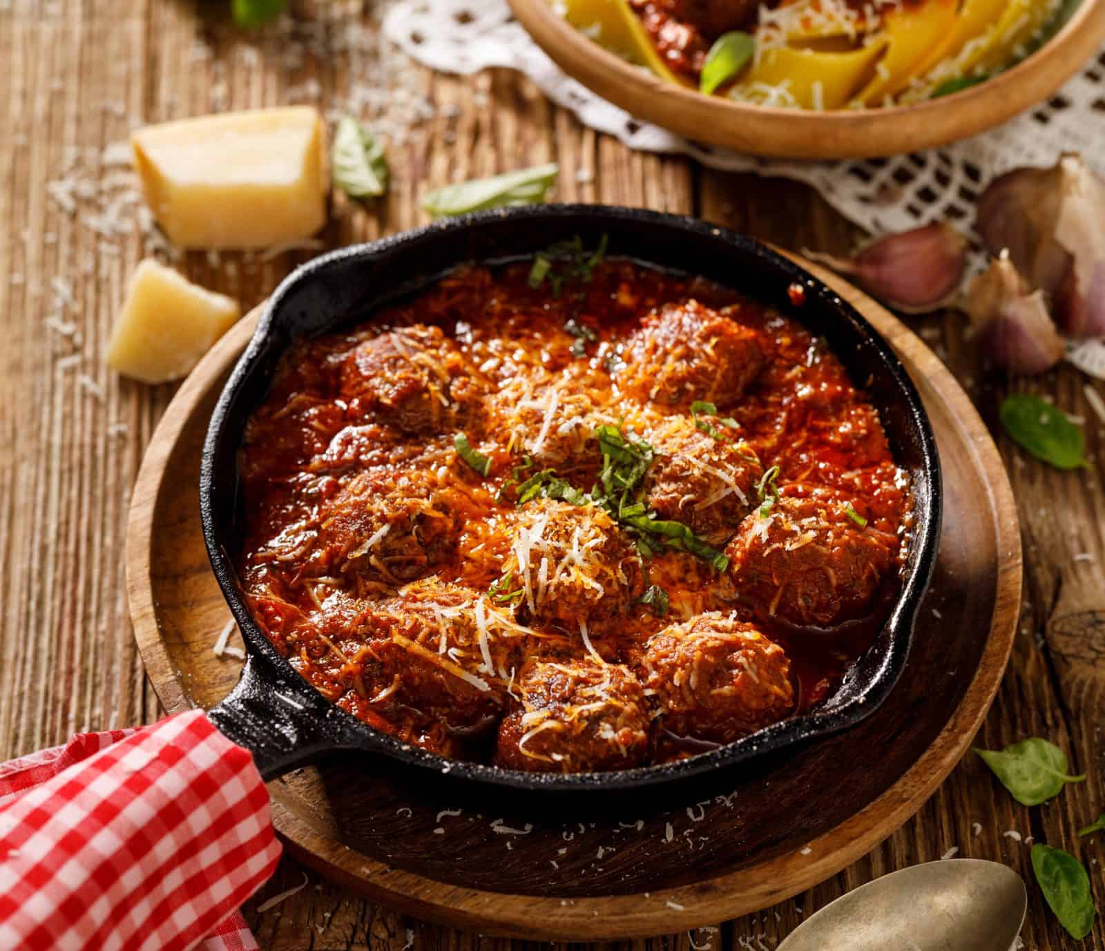 Kid-Friendly Chicken Dinners Adults Still Want to Eat 24 Chicken Meatballs in Tomato Sauce on a plate