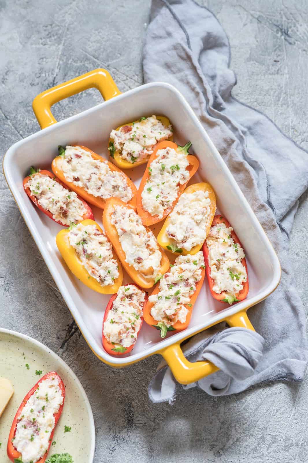 Thanksgiving Appetizers to Start the Feast 91 Cheese Stuffed Mini Peppers on a plate