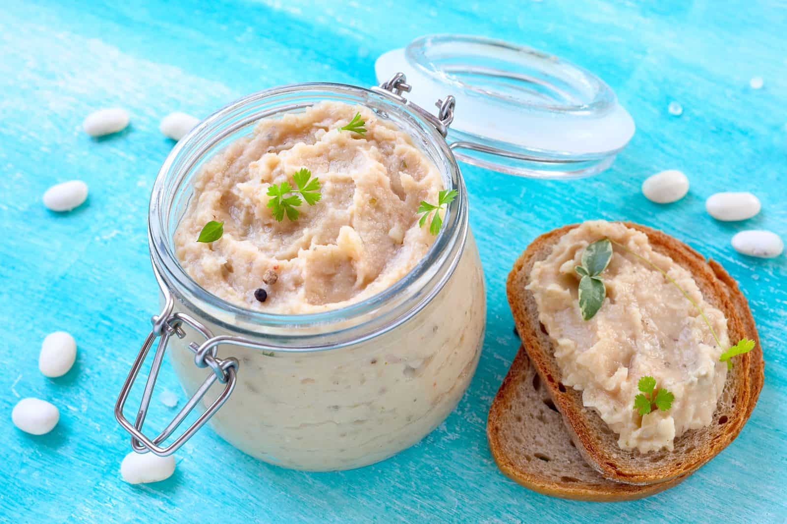 Vegan Appetizers That Disappear Fast at Parties 10 Garlic-Herb White Bean Dip on a plate