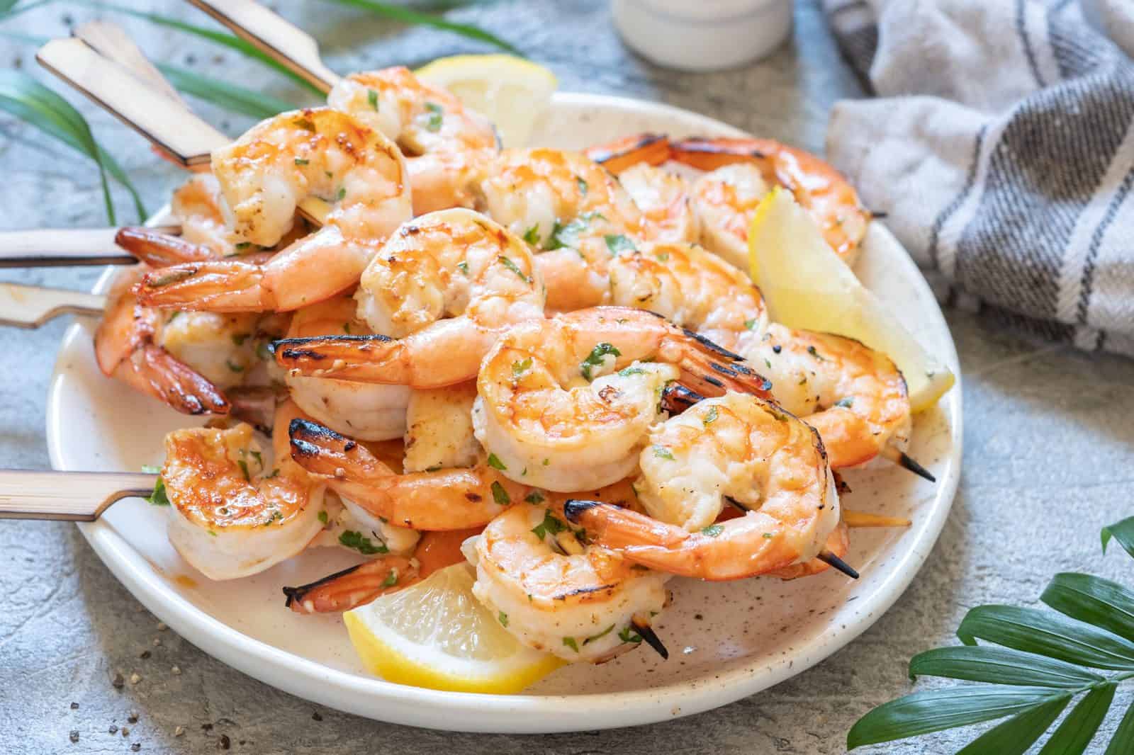 Grilled lemon-garlic shrimp skewers on a plate