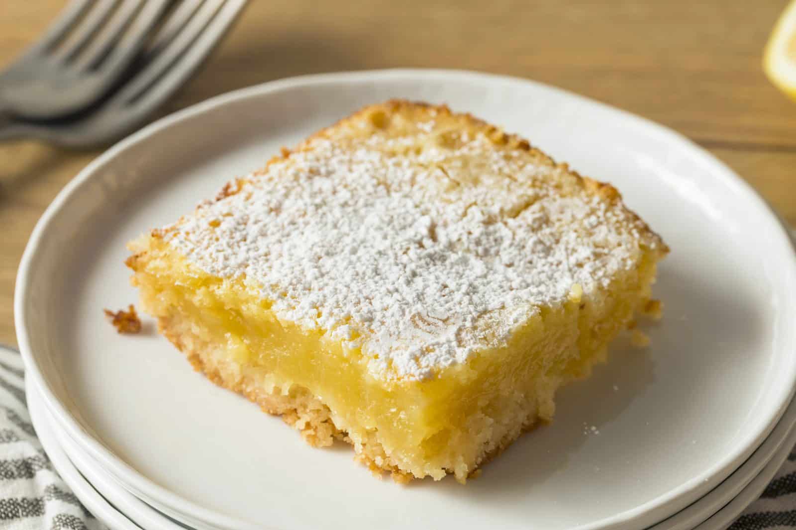 Easy Lemon Bars with a Buttery Shortbread Crust on a plate
