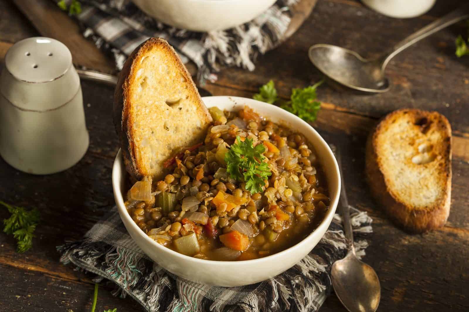 Vegetarian Main Dishes for Family Dinners 51 Lentil Soup with Crusty Bread on a plate