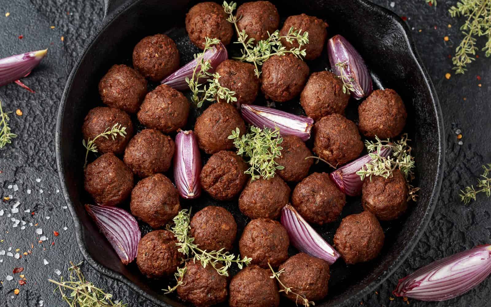 Vegan Appetizers That Disappear Fast at Parties 33 18) Mushroom-Walnut Meatballs on a plate