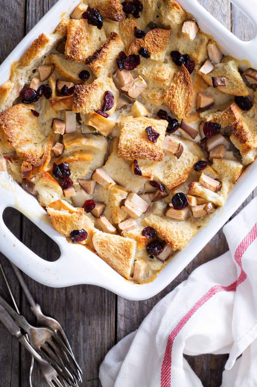 Pear Dessert Recipes for Easy Entertaining 10 Pear Bread Pudding with Vanilla Sauce on a plate