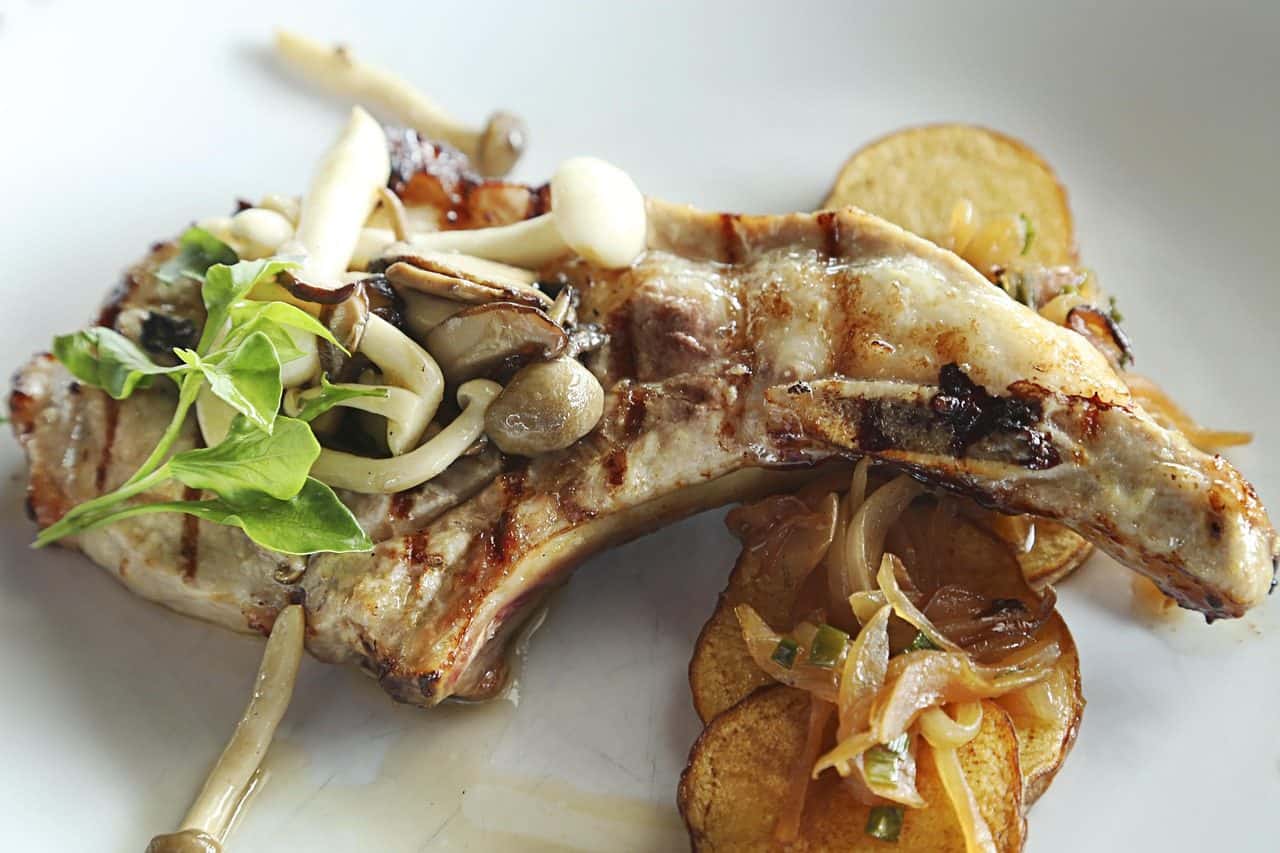 Crockpot Boneless Pork Chop Recipes for Hungry Families 10 Mushroom Onion Pork Chops on a plate