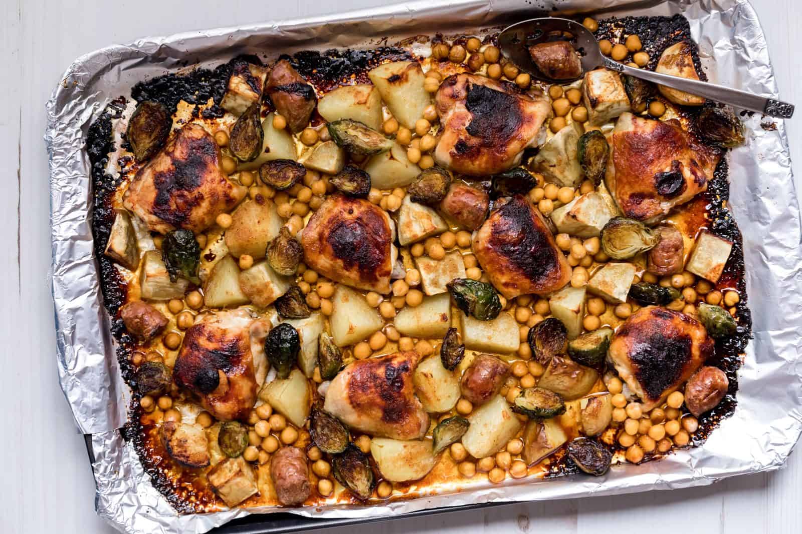 One-Pan Chicken Dinners for the Witching Hour 9 Roasted Lemon Chicken with Brussels Sprouts on a plate