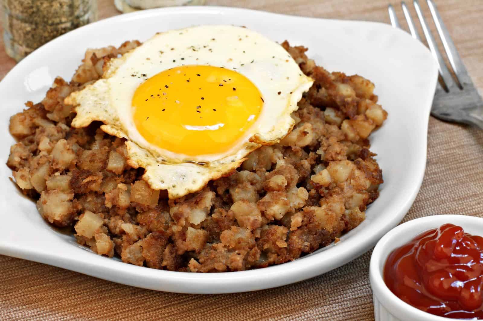 20 Easy Ground Beef Recipes for Weeknight Dinners 17 Simple Beef and Potato Hash with Fried Eggs on a plate