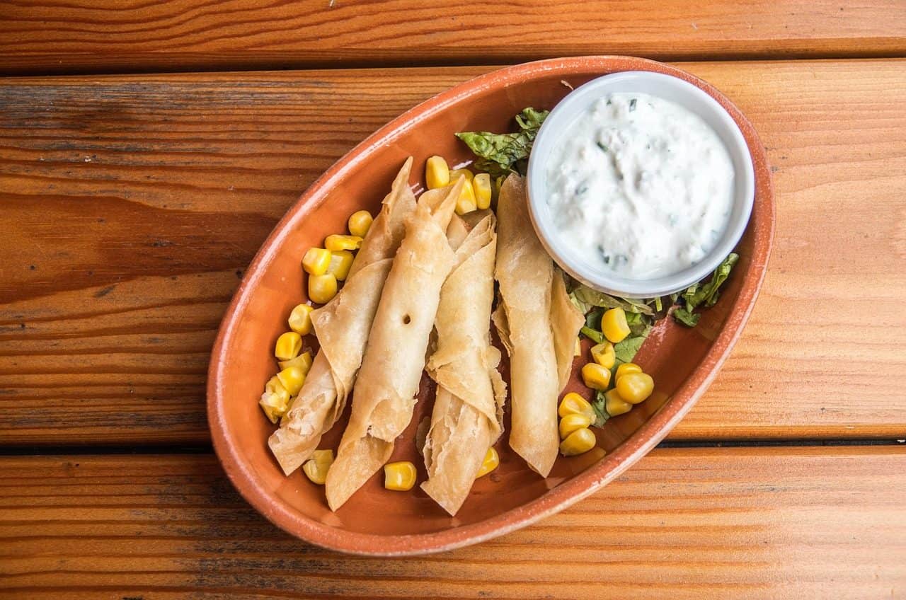 Vegan Appetizers That Disappear Fast at Parties 8 Sweet Potato Black Bean Taquitos on a plate