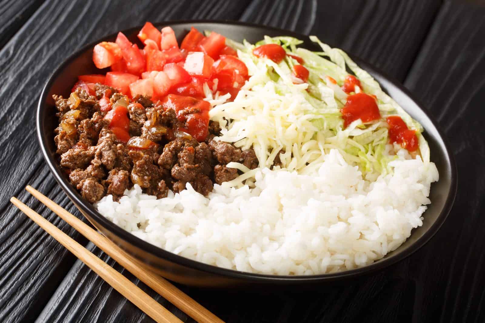 These 20 Easy Ground Beef and Rice Dishes Will Save Your Busy Weeknights 46 Taco Rice Bowl Supreme on a plate