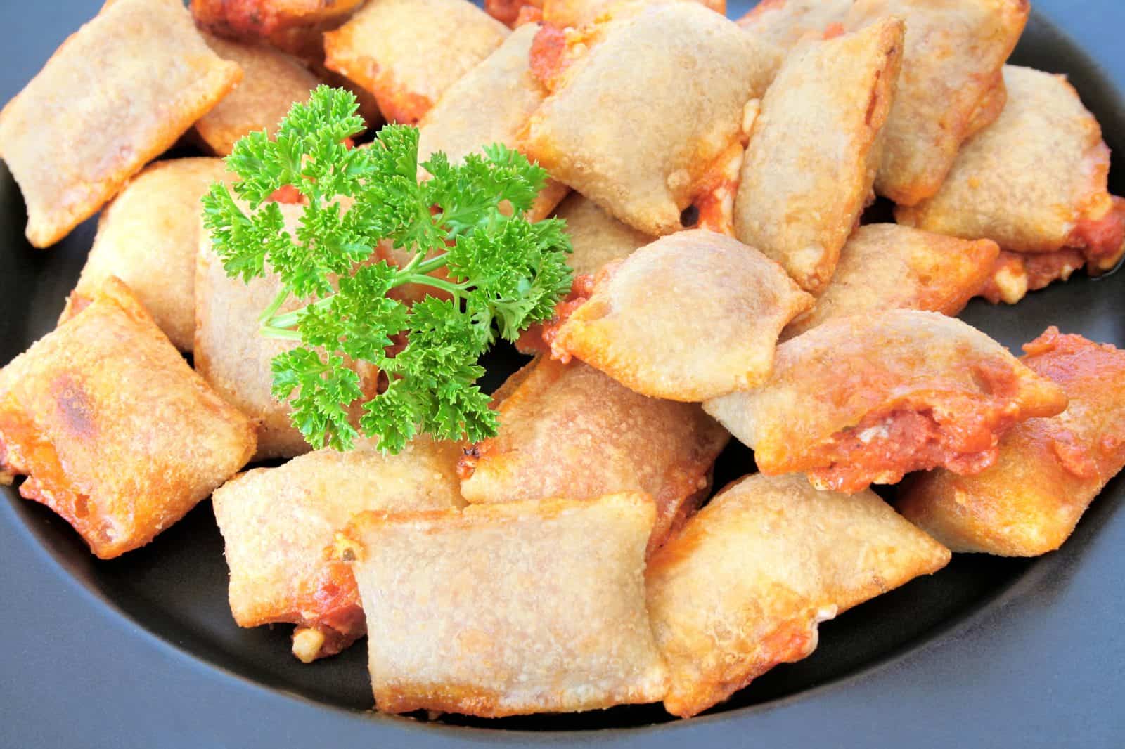 Vegan Appetizers That Disappear Fast at Parties 45 24) Vegan Pizza Rolls on a plate